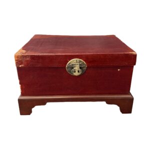 Red Leather Trunk on Wooden Stand