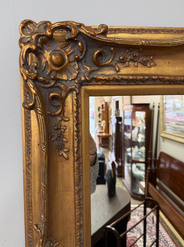 Heavily Carved Baroque-Style Gold Mirror Heavily Carved Baroque-Style Gold Mirror